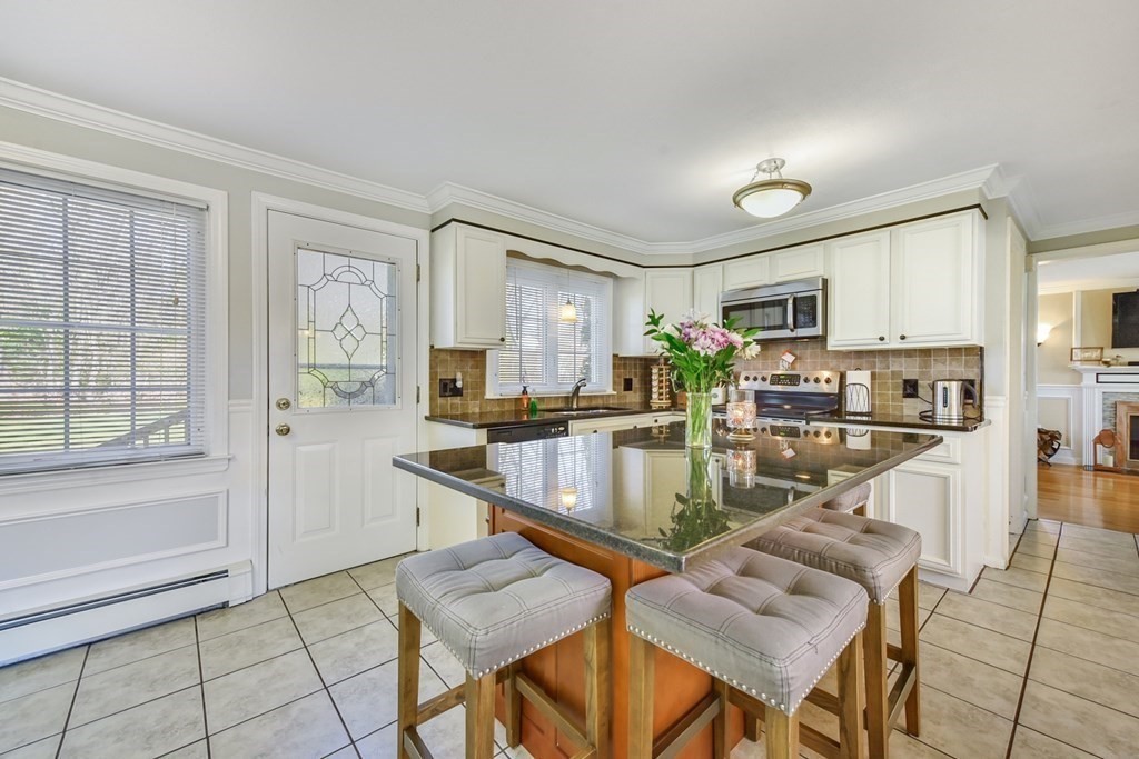 322 Wolf Swamp Road Longmeadow, MA 01106 - Photo 5 of 24 a view of a kitchen with kitchen island granite countertop lots of counter top space and windows