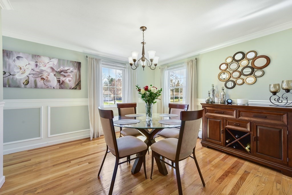 322 Wolf Swamp Road Longmeadow, MA 01106 - Photo 8 of 24 a view of a dining room with furniture wooden floor and a chandelier