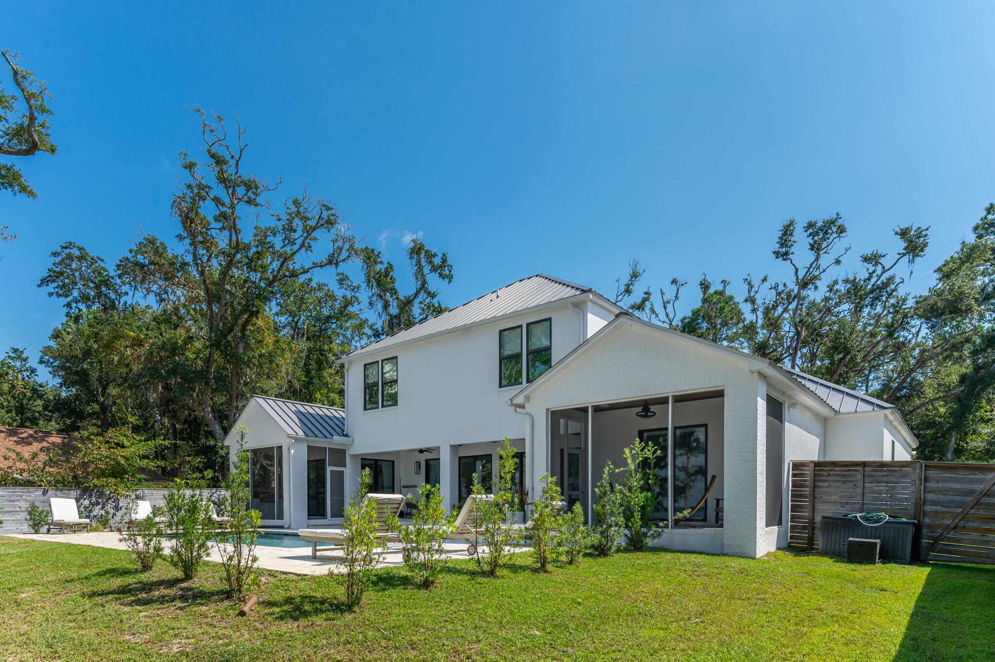 164 Bay Trace Santa Rosa Beach, FL 32459 - Photo 23 of 90 a front view of a house with a garden
