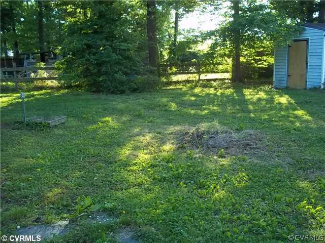 13917 Hackberry Road Chester, VA 23836 - Photo 3 of 10 a backyard of a house with lots of green space