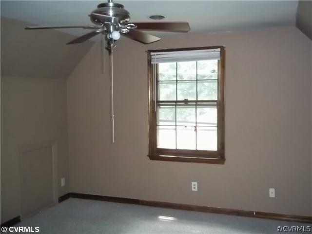 13917 Hackberry Road Chester, VA 23836 - Photo 6 of 10 a view of a room with a ceiling fan and a window