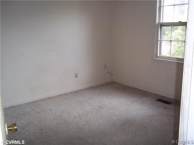 13917 Hackberry Road Chester, VA 23836 - Photo 9 of 10 an empty room with a window