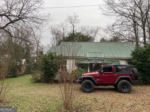 a view of a car in front of a house