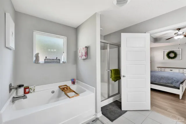 a bathroom with a tub and a sink