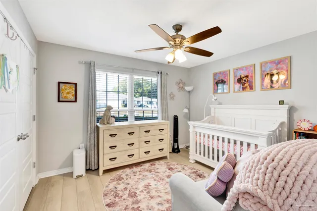 a bedroom with furniture and a window