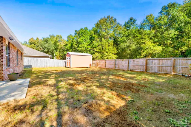 a view of a back yard of the house