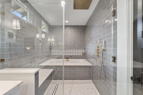a utility room with cabinets and washer