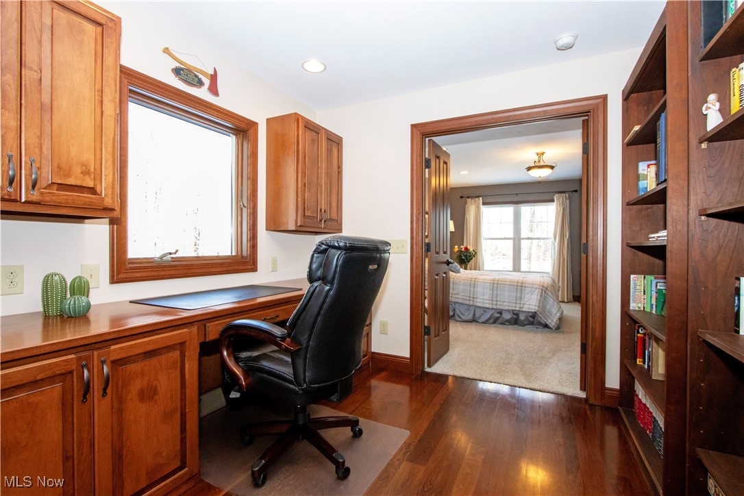 9669 Ruff Road West Salem, OH 44287 - Photo 2 of 5 Office area with built in desk and dark hardwood / wood-style floors