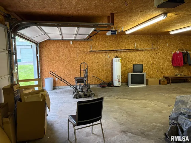 a living room with furniture a flat screen tv and a couch