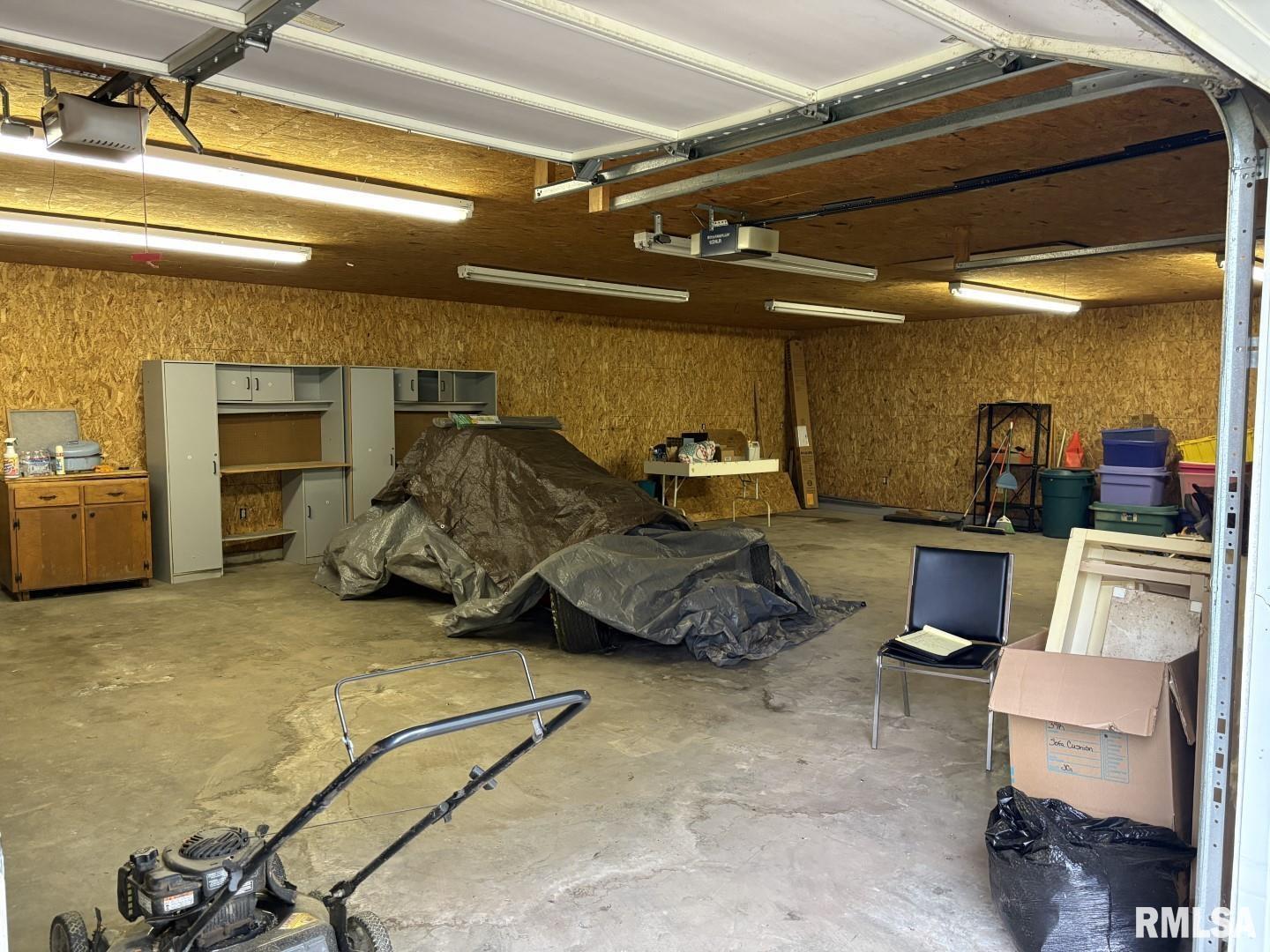 1606 West Faust Street Marion, IL 62959 - Photo 28 of 29 a garage with a couch and a stove