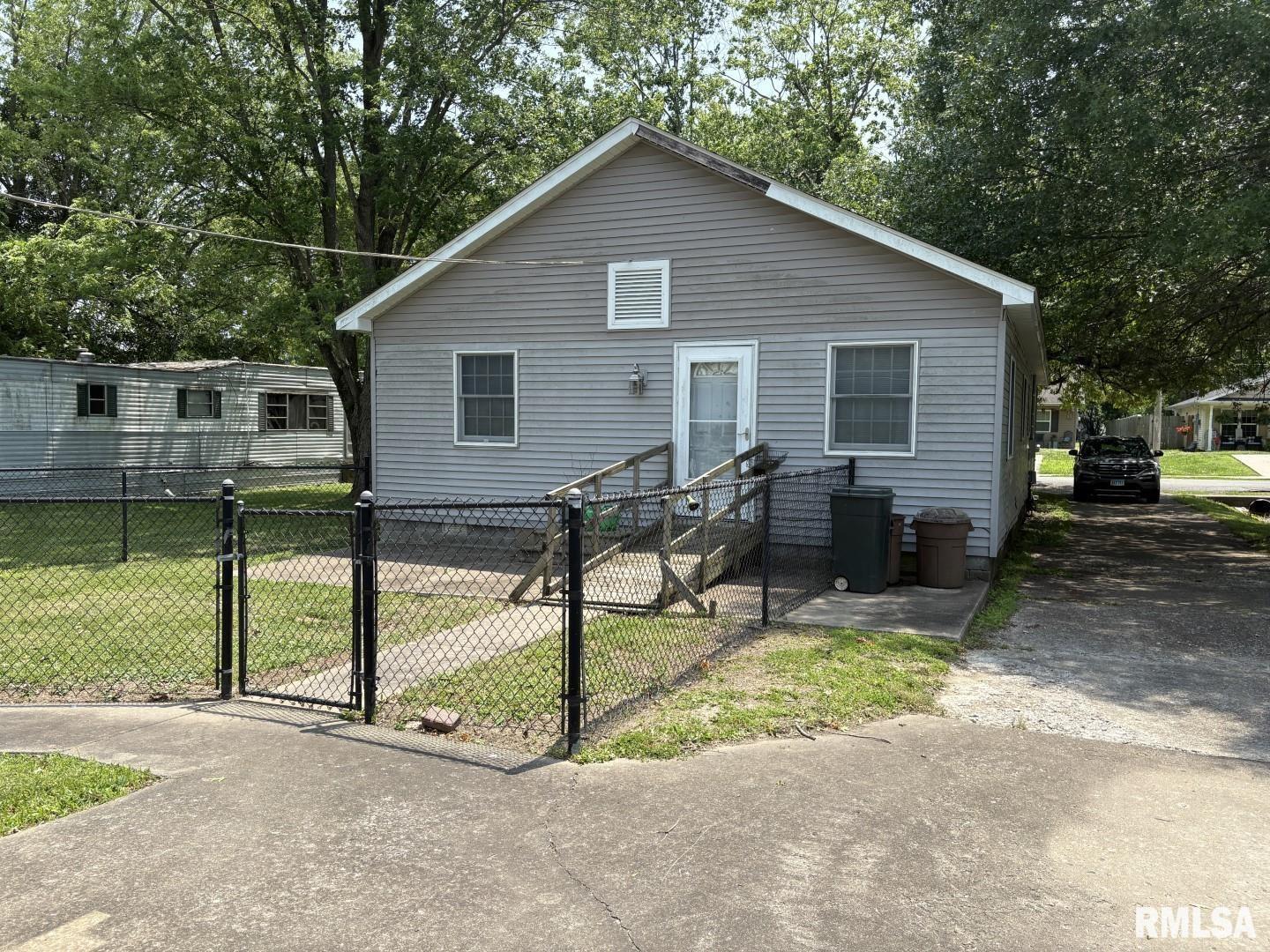 1606 West Faust Street Marion, IL 62959 - Photo 8 of 29 a view of a house with backyard and chairs