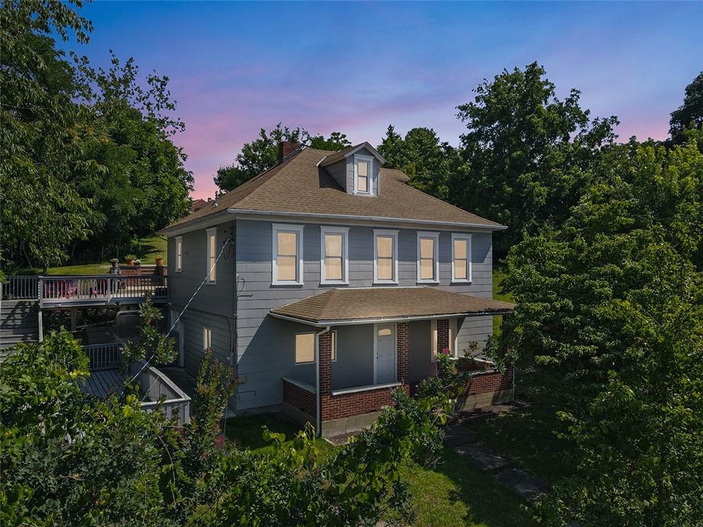 1815 Main Street Bridgeville, PA 15017 - Photo 1 of 32 a front view of a house with a yard
