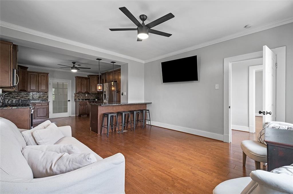 1815 Main Street Bridgeville, PA 15017 - Photo 11 of 32 a living room with furniture and a flat screen tv