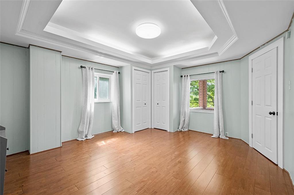 1815 Main Street Bridgeville, PA 15017 - Photo 19 of 32 wooden floor in an empty room with a window
