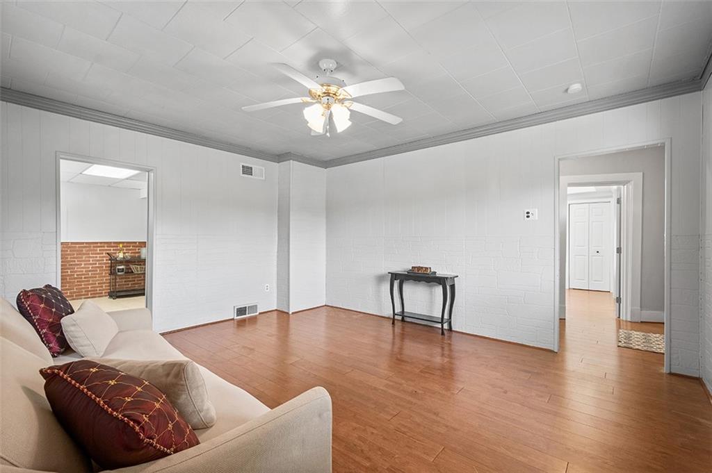 1815 Main Street Bridgeville, PA 15017 - Photo 20 of 32 a living room with furniture and a chandelier