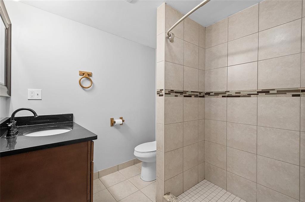 1815 Main Street Bridgeville, PA 15017 - Photo 25 of 32 a bathroom with a sink toilet and shower