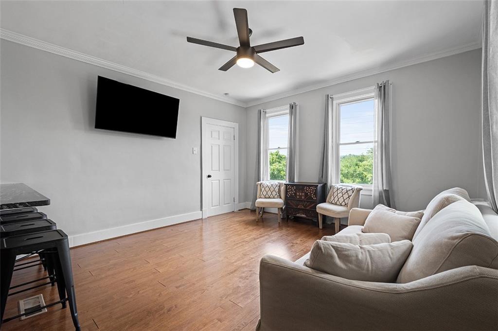 1815 Main Street Bridgeville, PA 15017 - Photo 10 of 32 a living room with furniture and a flat screen tv