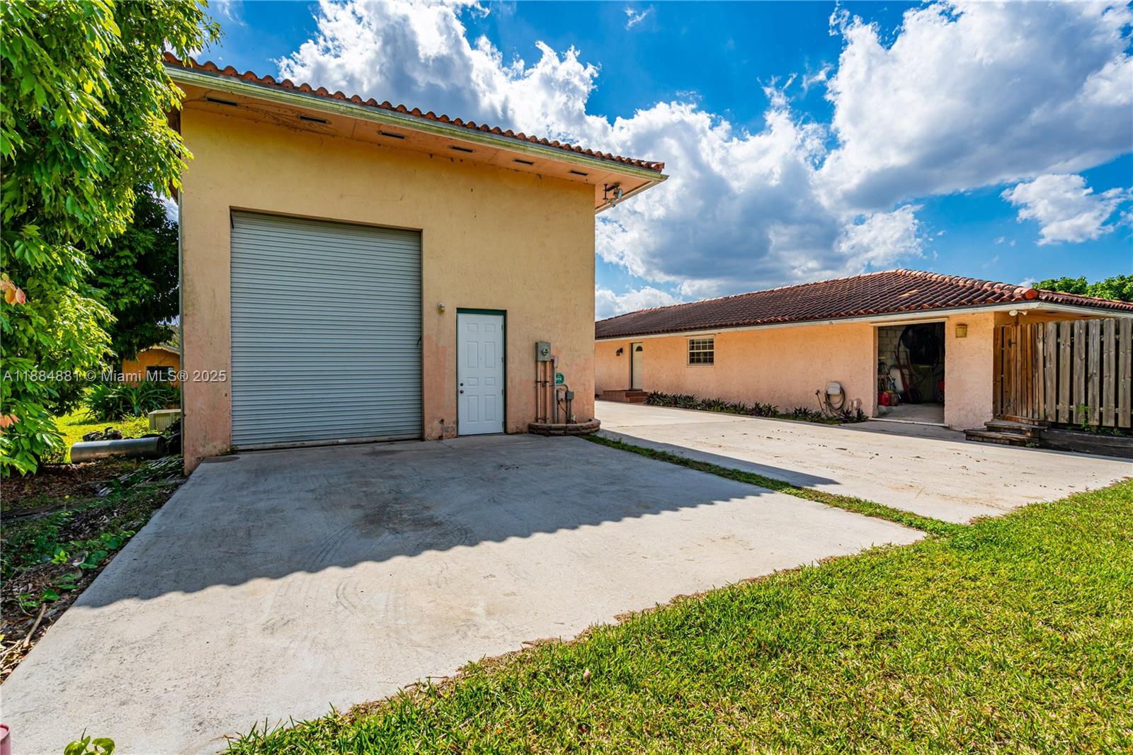 22220 Southwest 248th Street Homestead, FL 33031 - Photo 25 of 44 DETACHED GARAGE/WAREHOUSE WITH 1/1 APARTMENT, OFFICE, EMPLOYEE BATHROOM AND HURRICAN PROOF TANDEM 13X10 DOORS.. A LIL PAINT AND A PRESSURE CLEANING ON ROOF IS A GAME CHANGER. INCORPORATE THE 2 INTO ONE HUGE SPACE IF DESIRED.