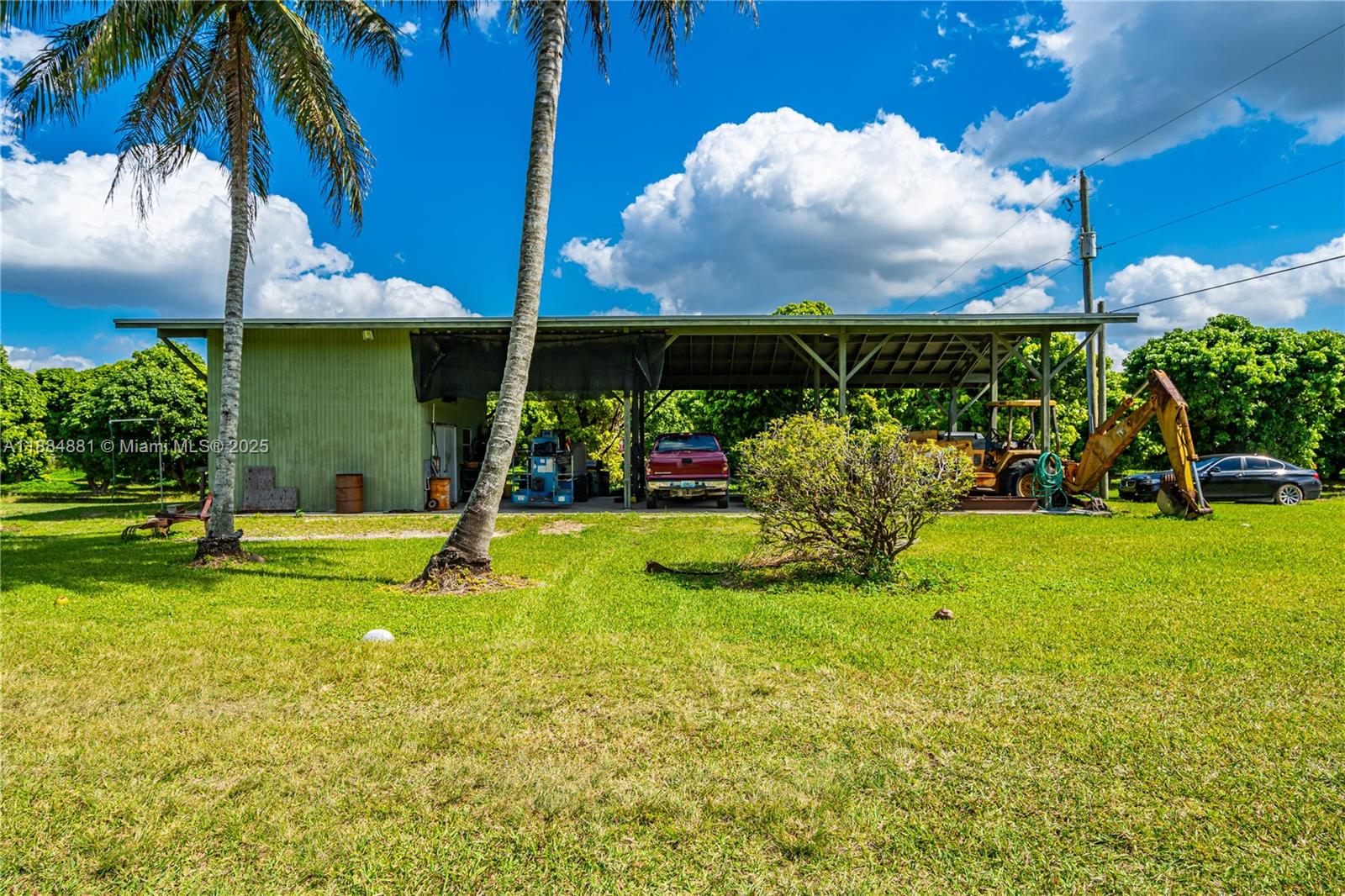 22220 Southwest 248th Street Homestead, FL 33031 - Photo 5 of 44 POLE BARN WITH A/C OFFICE, 4 CORNER SECURITY CAMERA SYSTEM ON PRIVATE NETWORK.EASY CONVERSION TO ANIMALS.. MOST EQUIPMENT WILL STAY