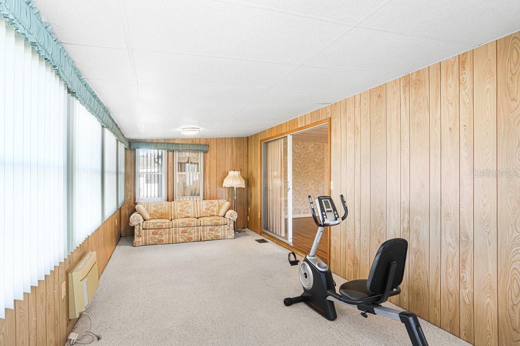 14299 Nectarine Street Brooksville, FL 34613 - Photo 13 of 41 a view of a room with gym equipment