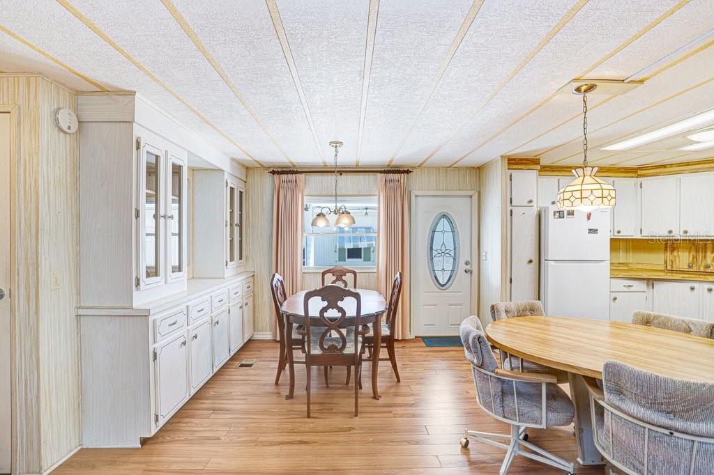 14299 Nectarine Street Brooksville, FL 34613 - Photo 15 of 41 a view of a dining room with furniture window and wooden floor