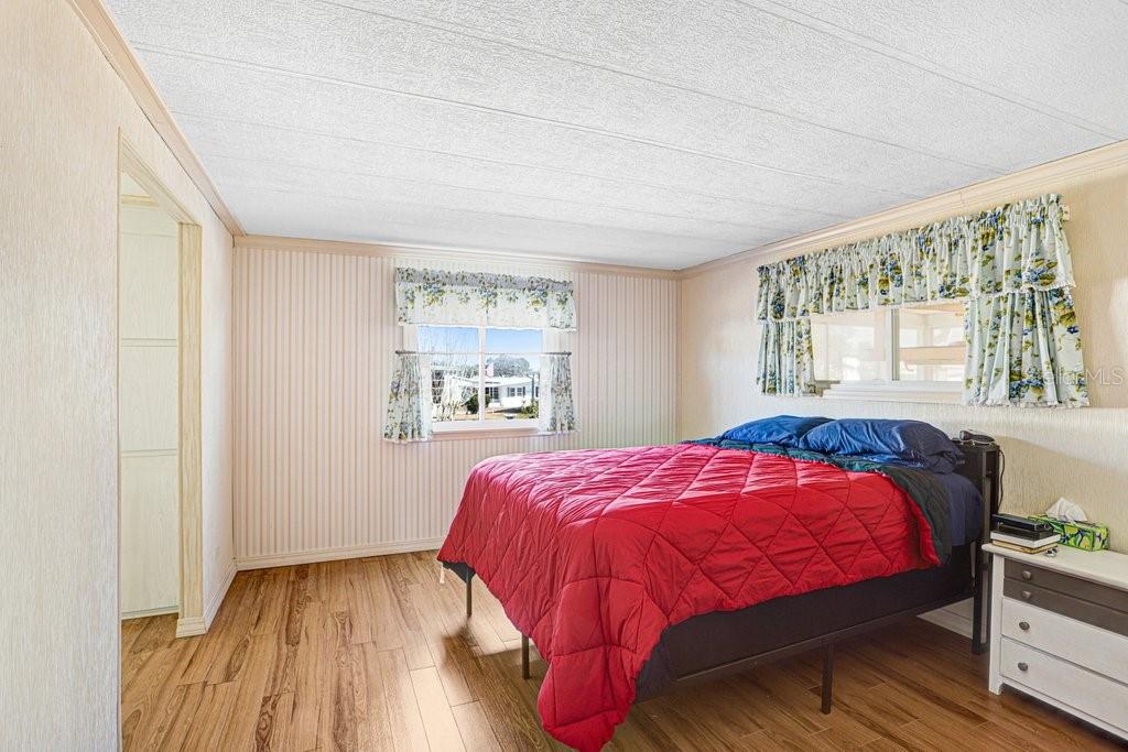 14299 Nectarine Street Brooksville, FL 34613 - Photo 21 of 41 a bedroom with a bed and window