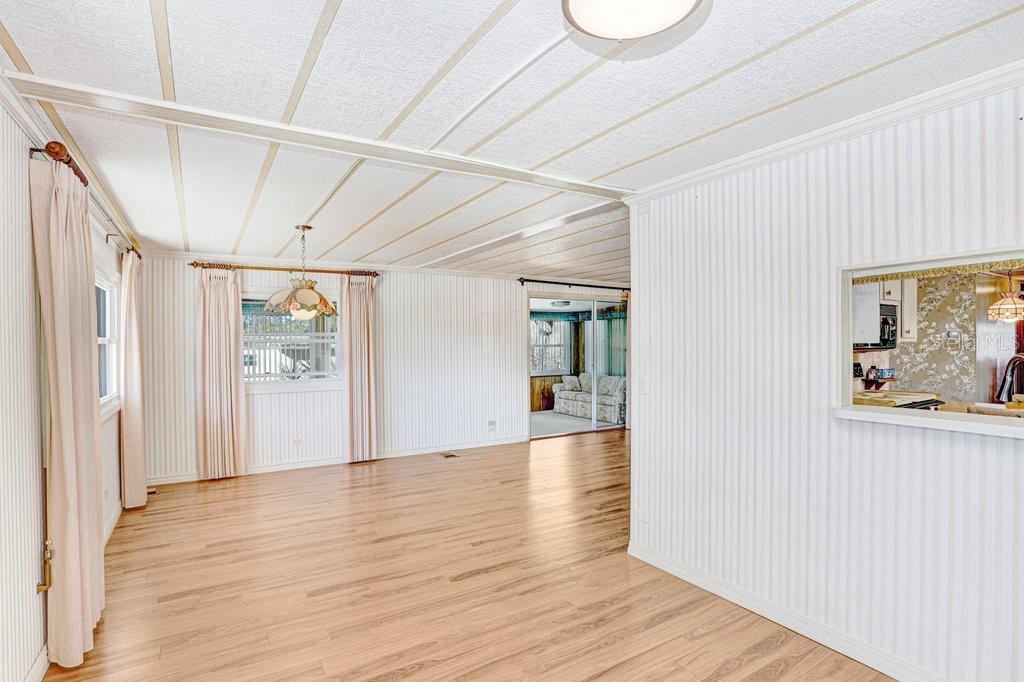 14299 Nectarine Street Brooksville, FL 34613 - Photo 9 of 41 a view of a room with wooden floor and window