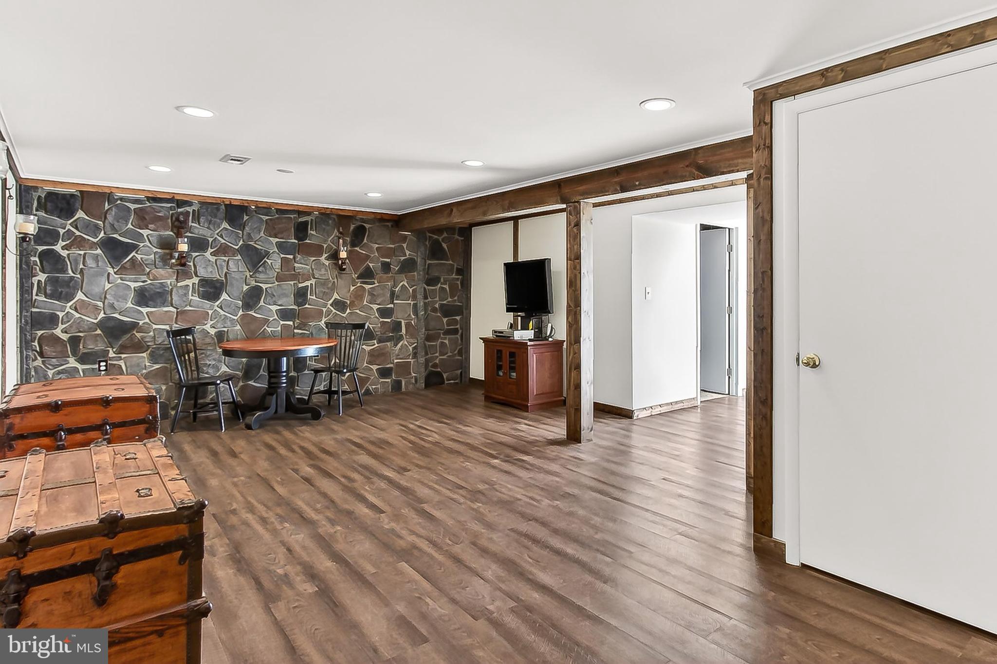 9056 Brook Ford Road Burke, VA 22015 - Photo 31 of 56 Stone accent wall, Vinyl plank flooring!