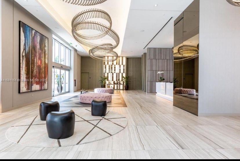 4010 South Ocean Drive, Unit R2407 Hollywood, FL 33019 - Photo 12 of 33 a living room with furniture and a large window