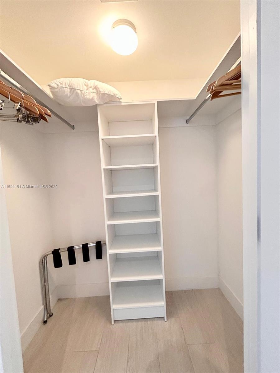 4010 South Ocean Drive, Unit R2407 Hollywood, FL 33019 - Photo 24 of 33 a view of walk in closet with empty racks