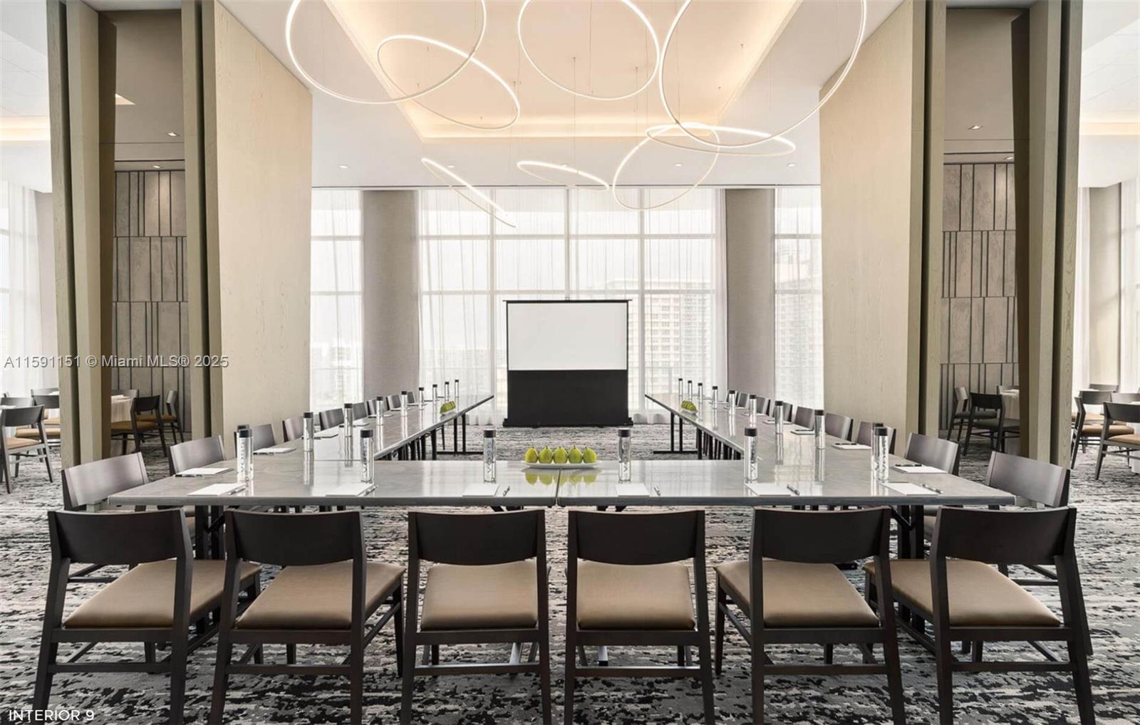 4010 South Ocean Drive, Unit R2407 Hollywood, FL 33019 - Photo 29 of 33 a dining room with furniture a large window and a chandelier