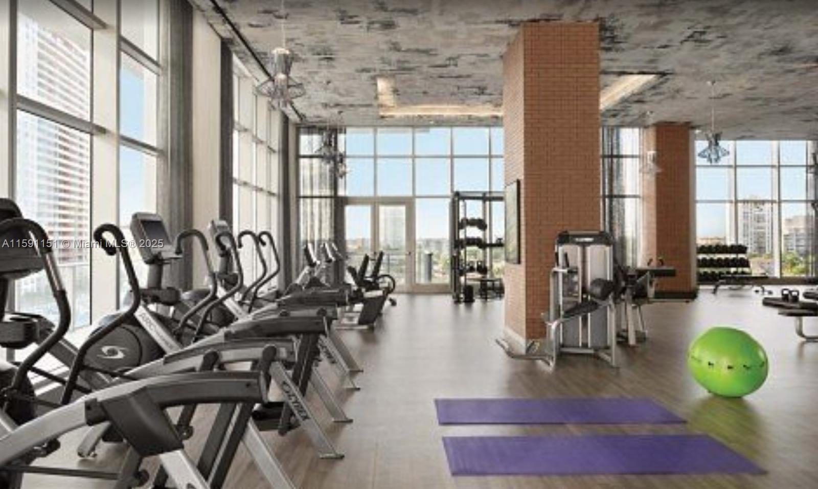 4010 South Ocean Drive, Unit R2407 Hollywood, FL 33019 - Photo 33 of 33 a living room with patio furniture and floor to ceiling windows