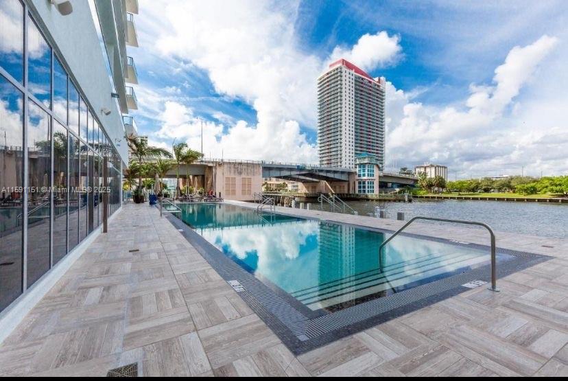 4010 South Ocean Drive, Unit R2407 Hollywood, FL 33019 - Photo 6 of 33 a view of a swimming pool with a terrace and seating space
