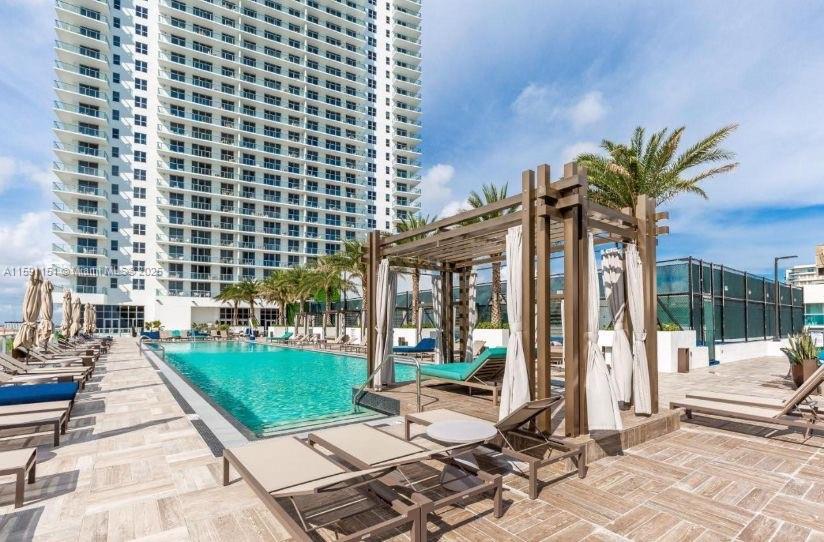 4010 South Ocean Drive, Unit R2407 Hollywood, FL 33019 - Photo 7 of 33 a view of a building with a patio