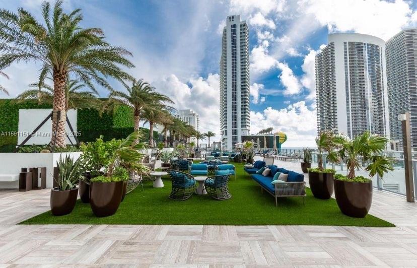 4010 South Ocean Drive, Unit R2407 Hollywood, FL 33019 - Photo 8 of 33 a view of a porch with chairs and potted plants