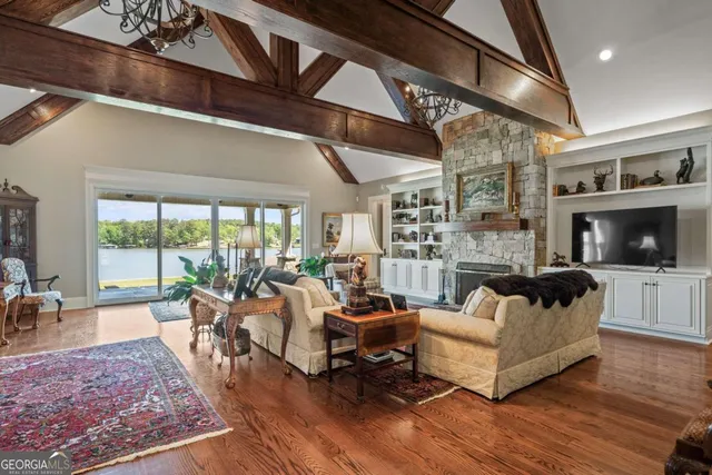 a spacious bathroom with a sink a chandelier and a mirror