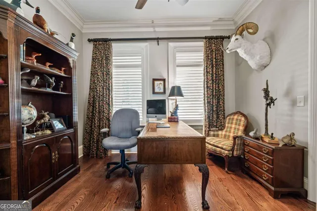 a kitchen with a center island cabinets and stainless steel appliances