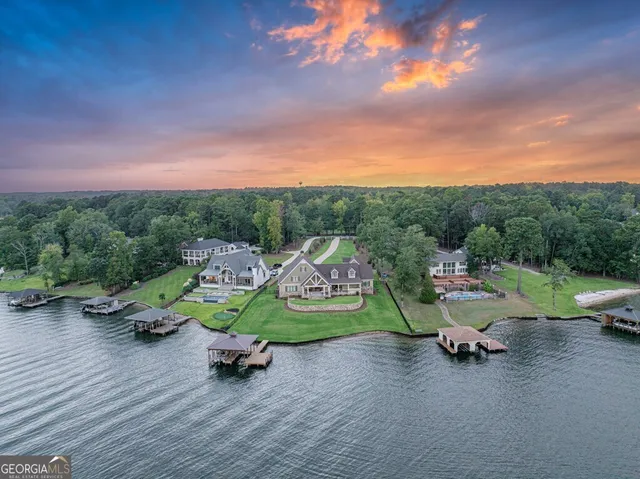 an aerial view of a houses with ocean view