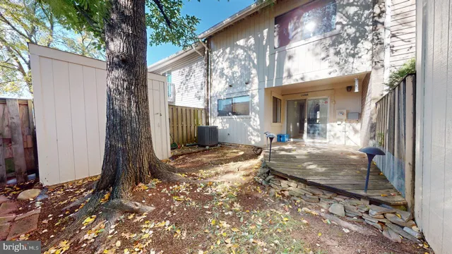 a view of a house with backyard of the house