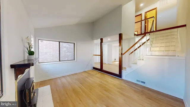 a view of an entryway with wooden floor and door