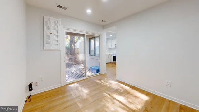 a view of a big room with windows