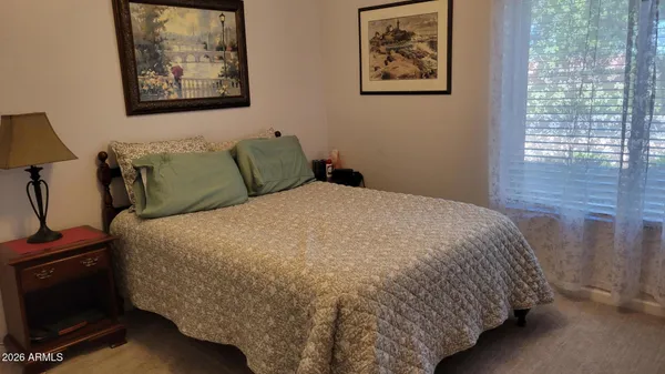 a view of a patio with table and chairs and potted plants