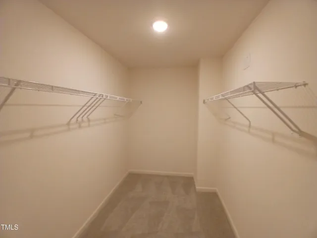 a bathroom with a sink a toilet a mirror and shower