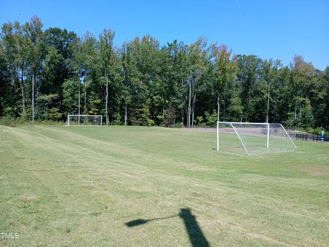 a view of a brick wall with living room and seating space
