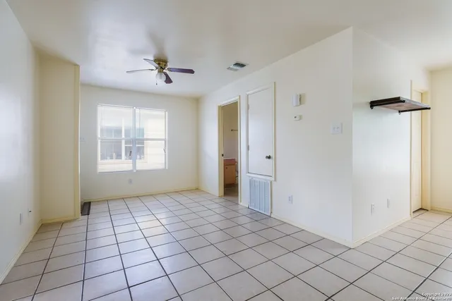 a view of an empty room and window