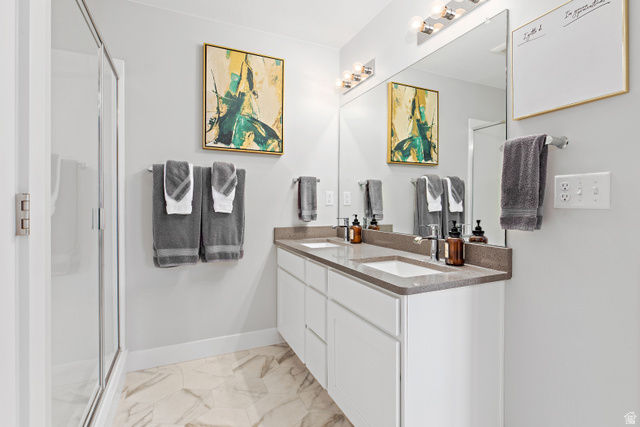 2343 Wysteria Drive Mapleton, UT 84664 - Photo 19 of 30 Full bath with double vanity, a shower stall, and light marble finish floors