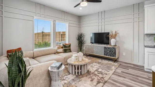 a kitchen with granite countertop a sink a counter top space stove and cabinets