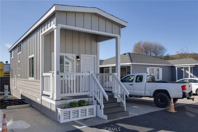 a front view of a house with parking space