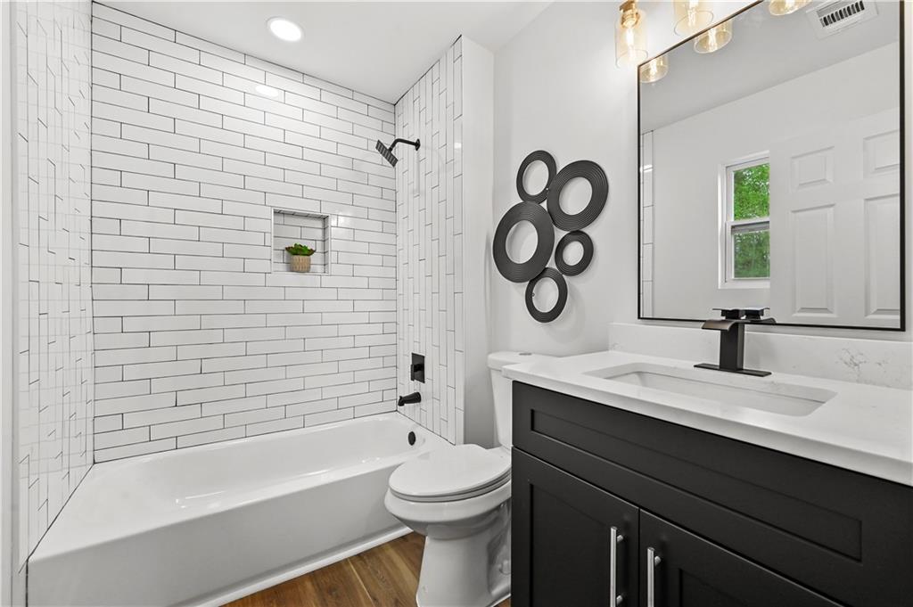 140 Buckhurst Way South Fulton, GA 30349 - Photo 20 of 45 a bathroom with a sink a toilet and a bathtub