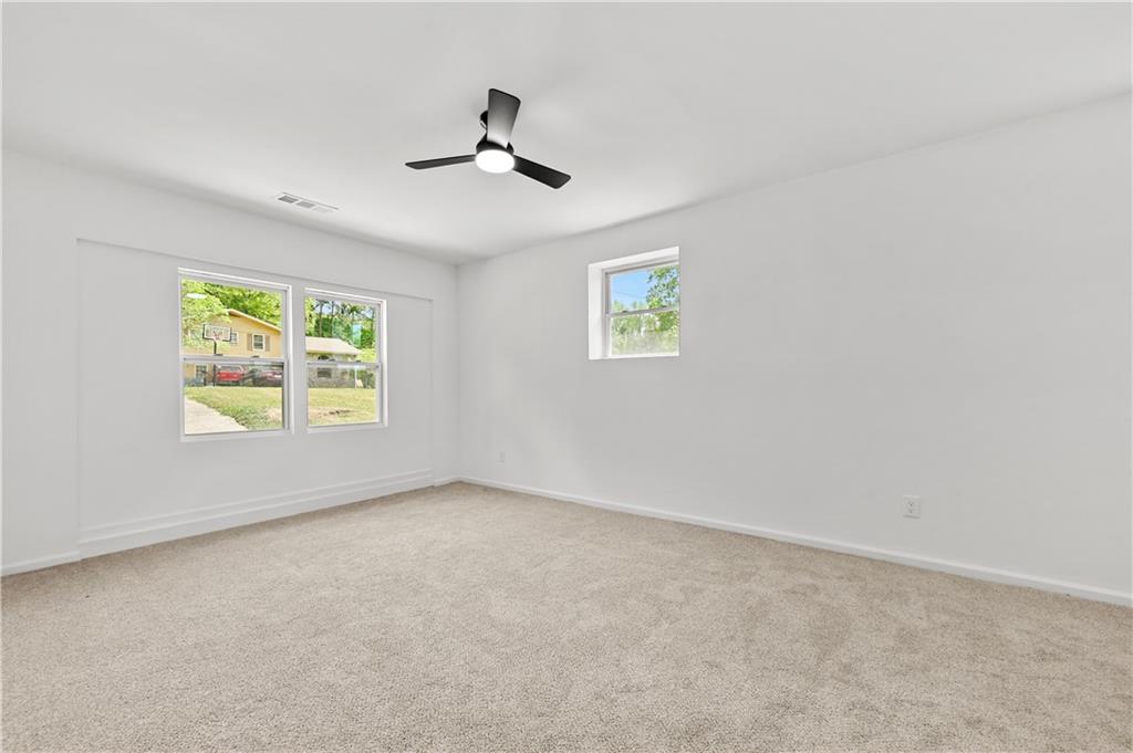 140 Buckhurst Way South Fulton, GA 30349 - Photo 21 of 45 a view of empty room with windows